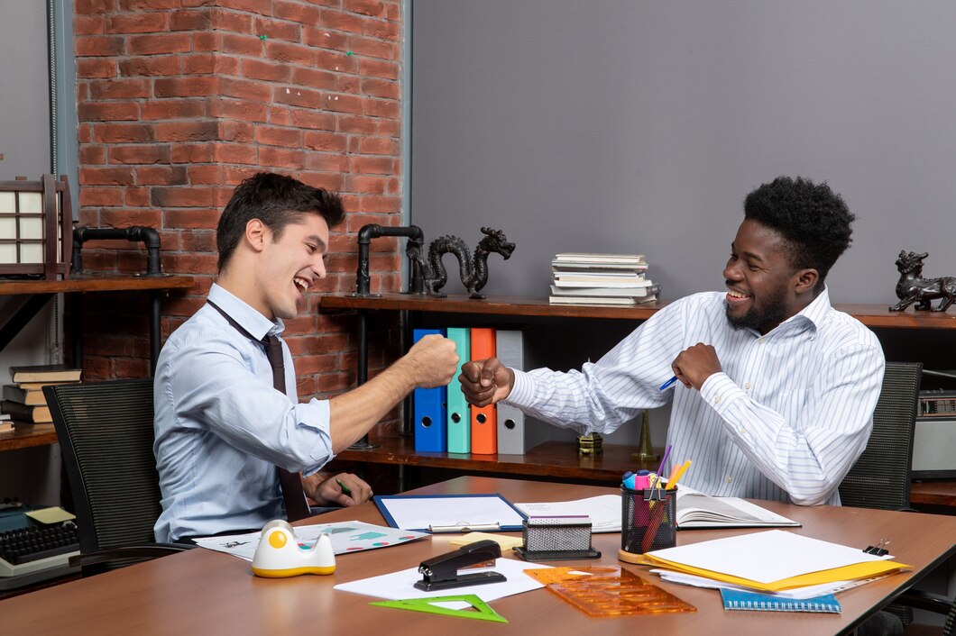 front-view-two-businessmen-fist-bump-together_140725-109502.jpg