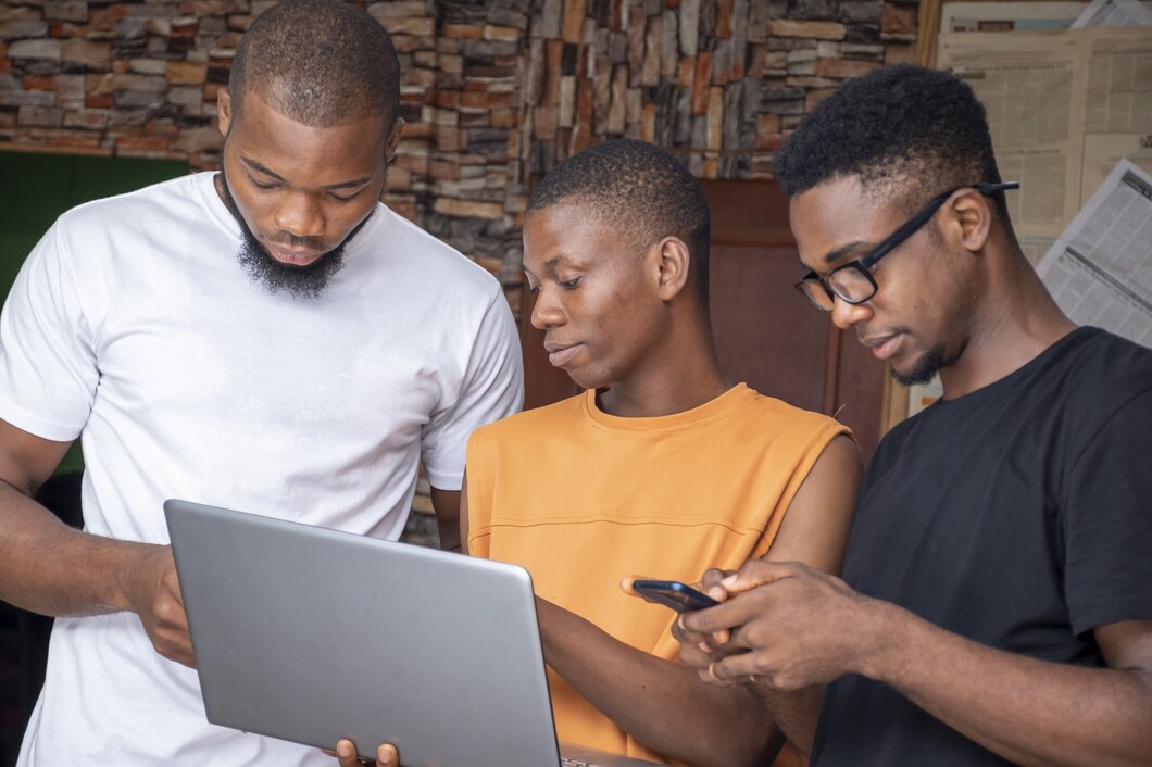 group-young-african-males-discussing-project-while-using-their-laptop-phones_181624-45059.jpg